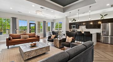 Grand Prairie apartment for rent - A modern living room with a grey sofa and a coffee table.