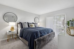 Fort Myers apartment for rent - a bedroom with a large bed and a window