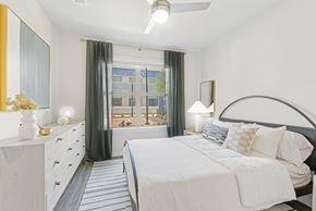 San Antonio apartment for rent - a bedroom with a large bed and a window