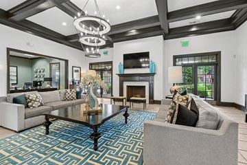 Grand Prairie apartment for rent - A living room with a grey couch and a coffee table.