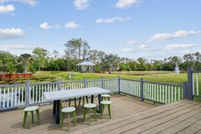 Winter Park apartment for rent - a picnic table on a deck overlooking a park with a gazebo