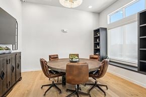 Sherman apartment for rent - A dining room with a round table and chairs.