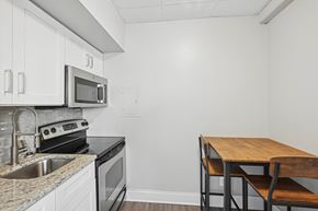 Nashville apartment for rent - A kitchen with a sink, stove, oven, and microwave.