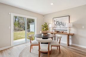 Jacksonville apartment for rent - A dining room with a round table and chairs.