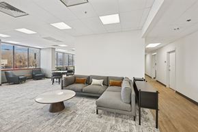 Madison apartment for rent - A modern office space with a grey carpet and furniture.