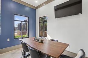 Alpharetta apartment for rent - A dining room with a wooden table and chairs.