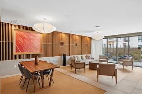 Oak Creek apartment for rent - A modern dining room with a wooden table and chairs.