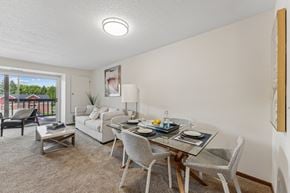 Eden Prairie apartment for rent - A dining room with a glass table and chairs.
