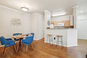 San Antonio apartment for rent - a dining room with a table and chairs and a kitchen