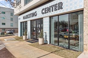 Atlanta apartment for rent - A building with a sign that says Marketing Center.