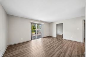 Indianapolis apartment for rent - A room with wooden floors and white walls.
