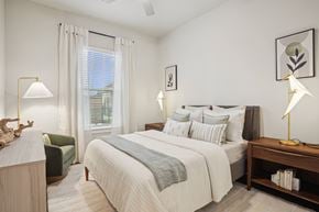 Mckinney apartment for rent - a bedroom with a bed and a window