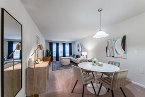 Raleigh apartment for rent - A dining room with a white table and chairs.