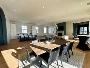 Zionsville apartment for rent - A modern dining room with a large table and chairs.