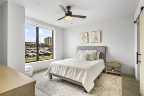 Middleton apartment for rent - A bedroom with a large bed and a ceiling fan.