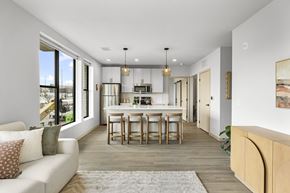 Middleton apartment for rent - A modern kitchen with a dining table and chairs.
