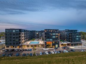 Madison apartment for rent - an aerial view of a building with a pool and parking lot