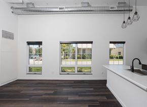 Fargo townhouse for rent - Carpeted Living Room at The Landing at 1001 NP, Fargo, ND, 58102
