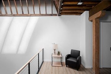 Fargo condo for rent - a living room with a chair and a table