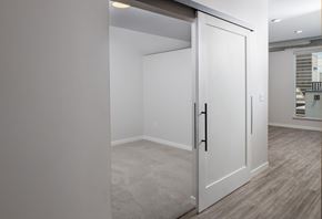 Fargo apartment for rent - Spacious Rooms with White Sliding Farm Doors at Kesler Apartments in Downtown Fargo, Fargo ND 58102
