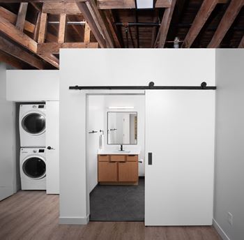 Bathroom with washing machine and dryer