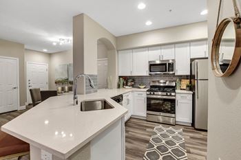 Quartz countertops with tile backsplash