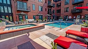 Minneapolis apartment for rent - our apartments have a pool and lounge area with tables and chairs