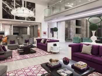 Swanky clubhouse with lounge seating and tvs