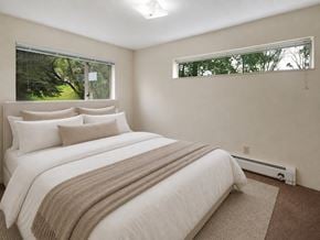 Anchorage apartment for rent - A bedroom with a large bed and a window.