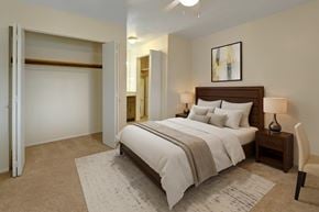 Anchorage apartment for rent - A bedroom with a large bed and a chair.