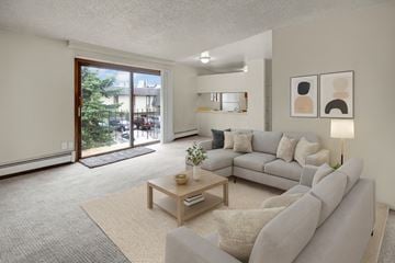 Anchorage apartment for rent - A living room with a grey couch and a coffee table.