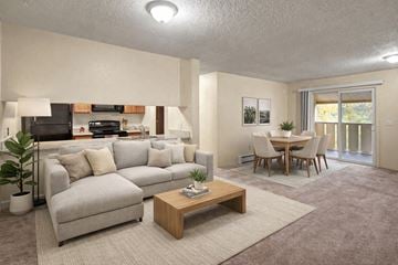 Anchorage apartment for rent - A living room with a grey couch and a wooden coffee table.