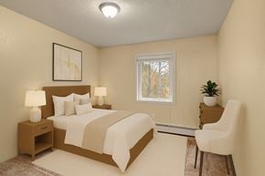 Anchorage apartment for rent - A cozy and birght bedroom here at Hillside Chalet with a bed with neutral-toned sheets and a blanket, nightstands, soft-toned lamp, an accent chair, and small dresser with a plant atop.