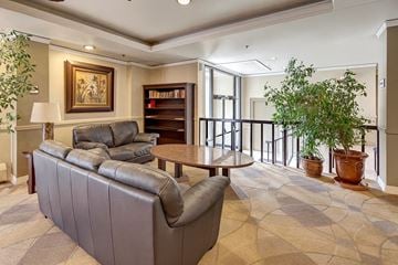 Juneau apartment for rent - A living room with a grey sofa and a wooden coffee table.