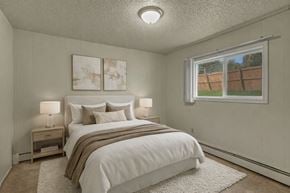 Anchorage apartment for rent - A bedroom with a large bed and two nightstands.