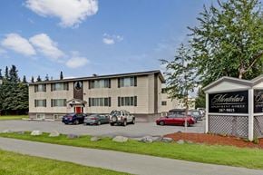 Anchorage apartment for rent - A building with a sign that says Heartland Apartment Homes.