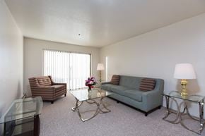 Anchorage apartment for rent - A living room with a couch, chair, and coffee table.