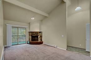 Anchorage apartment for rent - A living room with a fireplace and sliding glass doors.