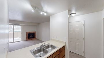 Anchorage apartment for rent - A kitchen with a sink and a fireplace.