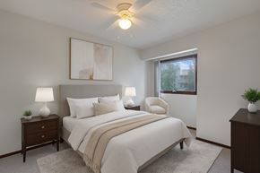 Anchorage apartment for rent - A calm bedroom here at Russian Jack with a cozy bed, soft neutral bedding, and matching nightstands with lamps for a warm, inviting feel.