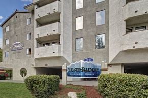 Anchorage apartment for rent - Apartment complex with a sign that says Silverridge Apartments Homes.