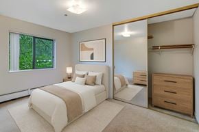 Anchorage apartment for rent - A bedroom with a large bed and a dresser.