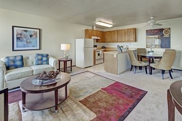 Anchorage apartment for rent - A living room with a white couch and a coffee table.