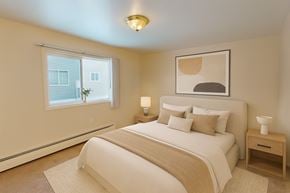 Anchorage apartment for rent - A bedroom with a large bed and a window.