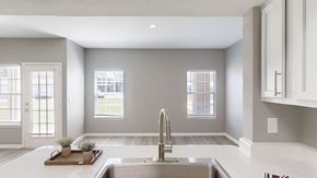 Bentonville apartment for rent - A modern kitchen with a stainless steel sink and a window.