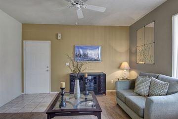 Phoenix apartment for rent - A living room with a couch, a coffee table, and a painting on the wall.