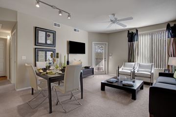 Phoenix apartment for rent - A living room with a dining table and chairs.