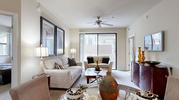 Phoenix apartment for rent - A living room with a white couch and a wooden coffee table.