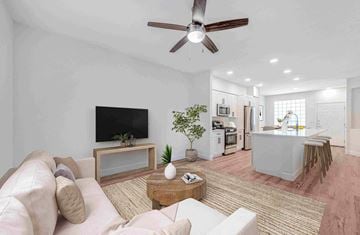 Phoenix apartment for rent - A living room with a white couch and a television.