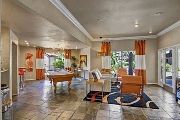 Scottsdale apartment for rent - A spacious living room with a pool table and comfortable seating.